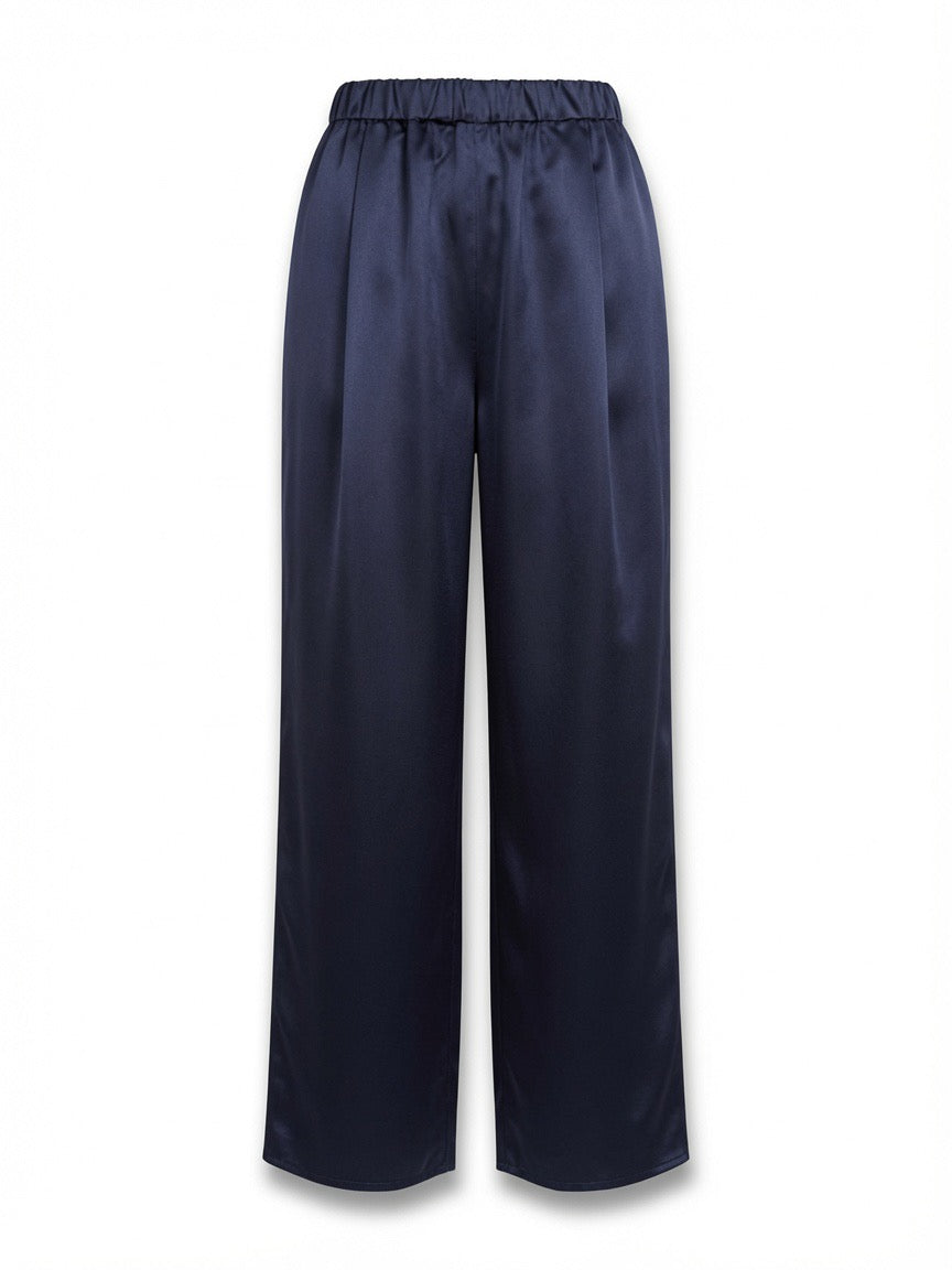 A pair of dark navy wide-leg pants with an elastic waistband, with front pleats and side pockets
