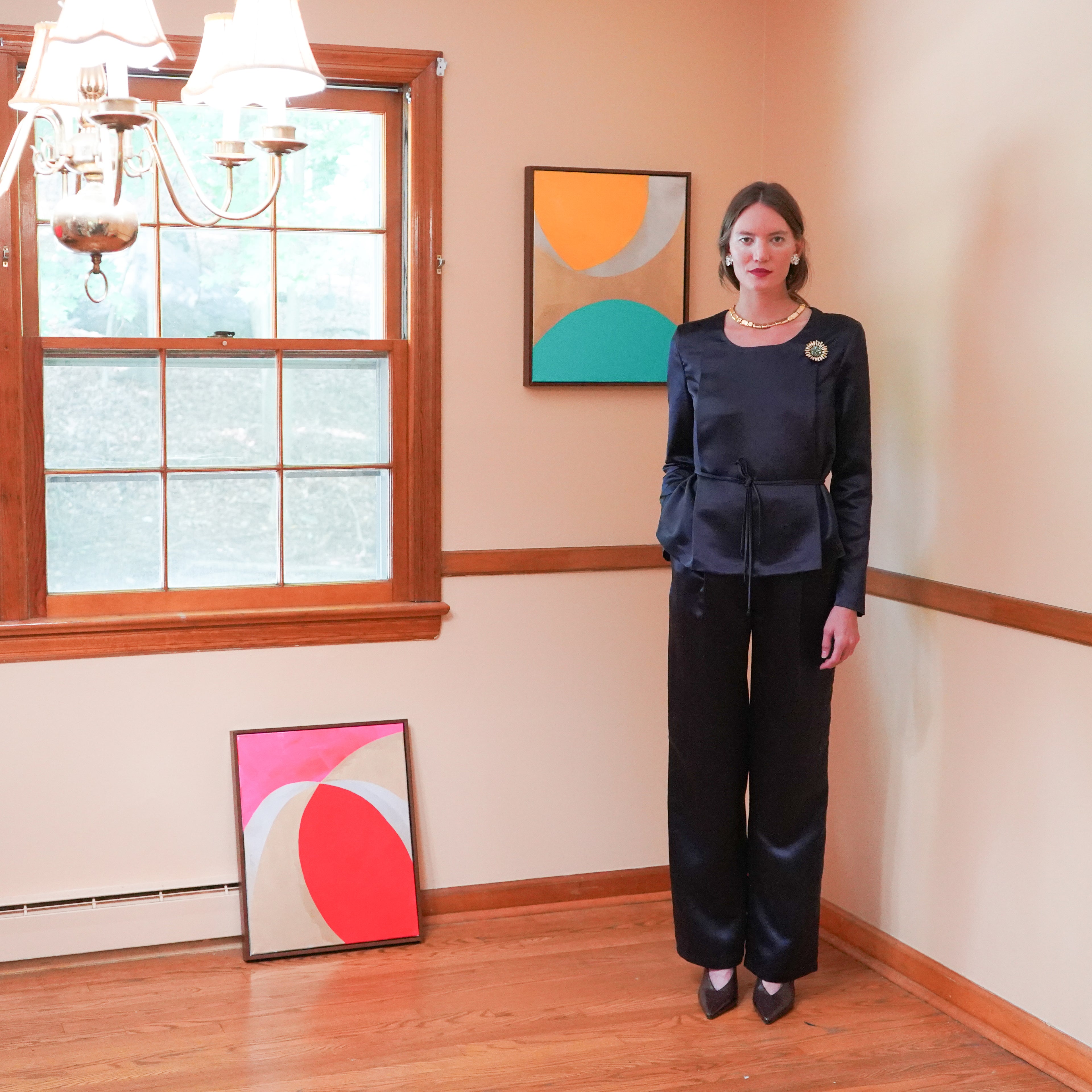 Dark navy satin long-sleeve top and matching wide-leg pants. 