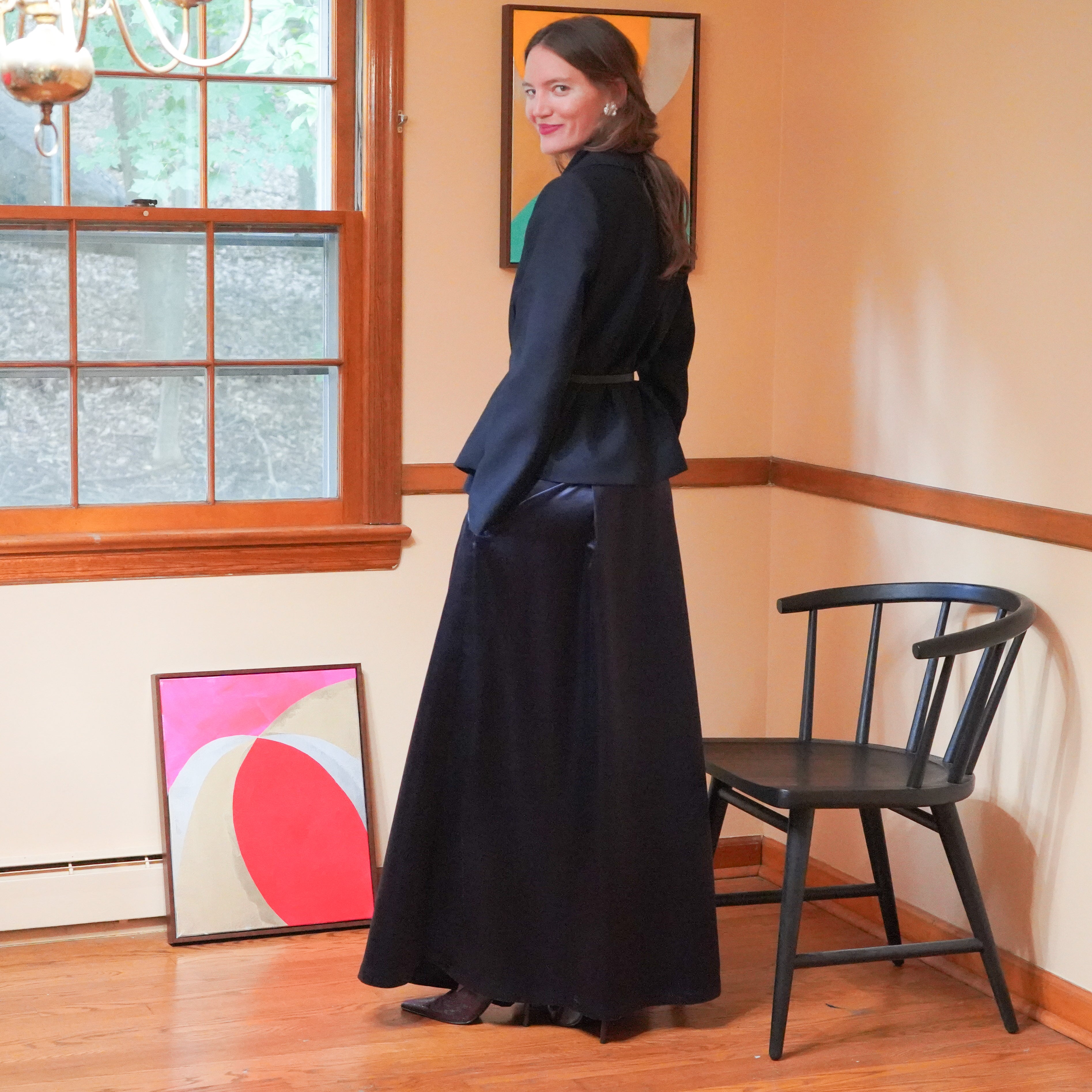 Dark navy wrap-style blazer with a draped scarf collar and maxi charmeuse skirt.
