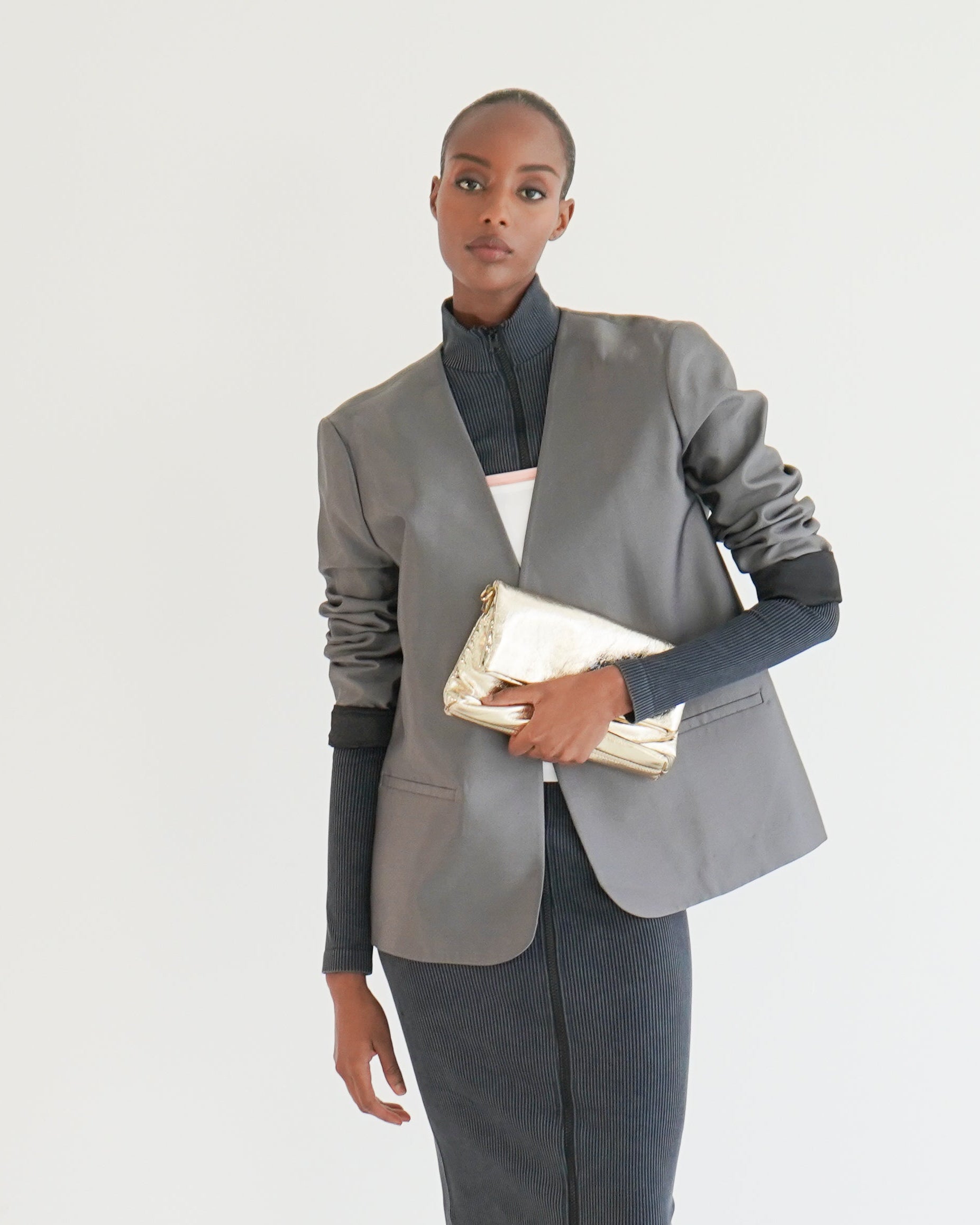 Hazel satin jacket detail — women's sleek structured outerwear close-up
