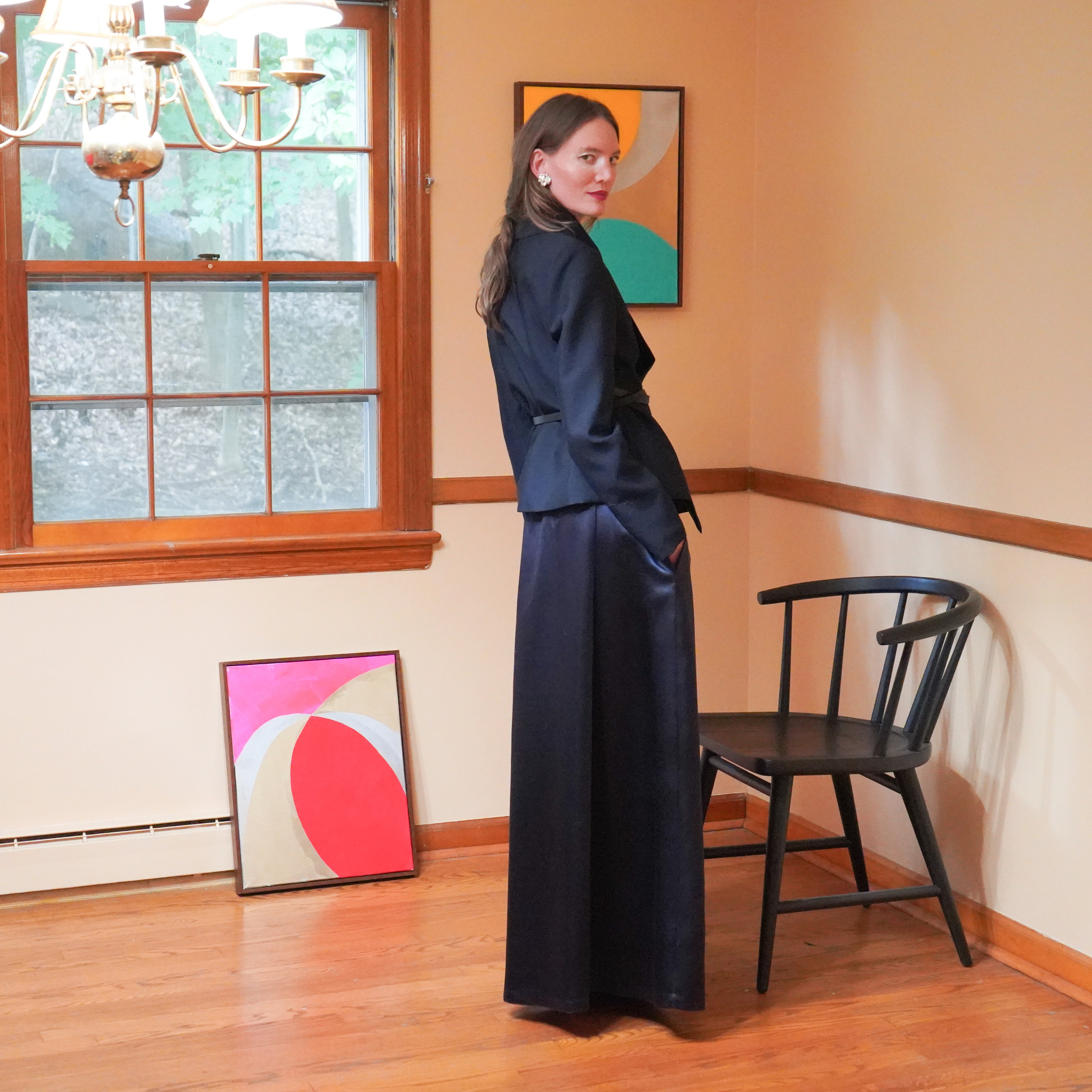 Dark navy satin two-piece outfit consisting of a cropped jacket and a maxi skirt. 
