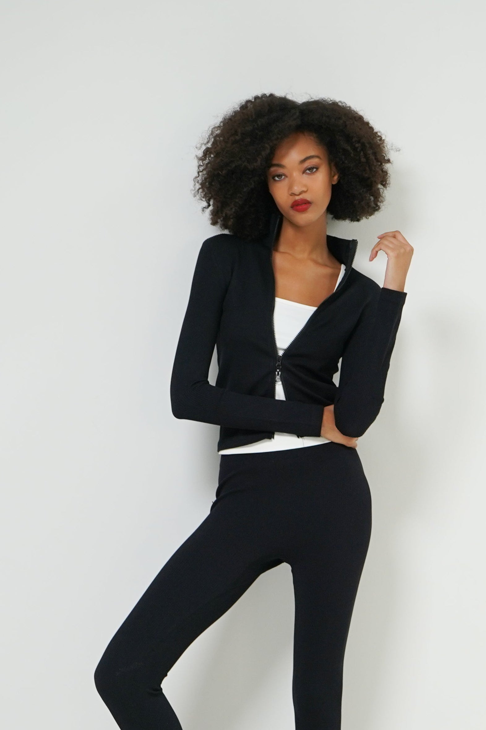 Lara top zip front detail — women's seamless rib knit close-up
