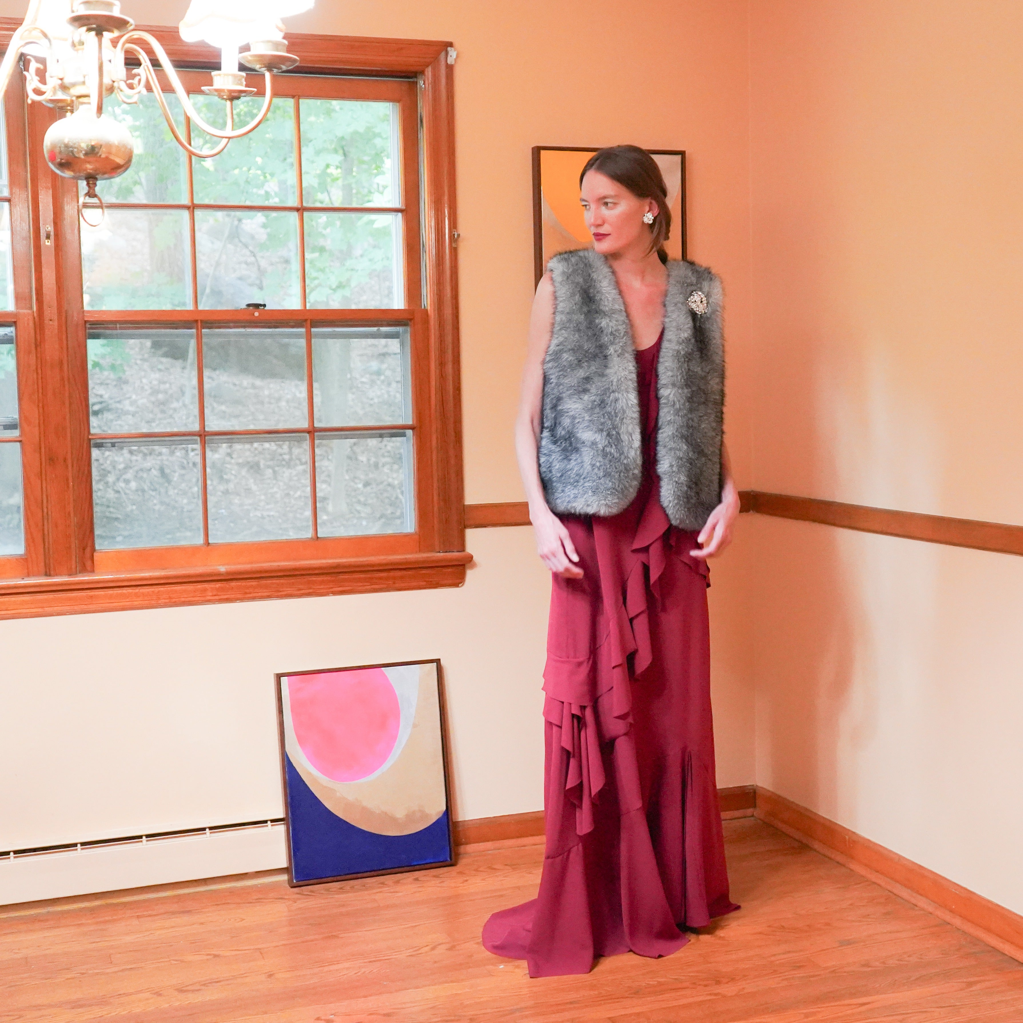 Mimosa faux fur vest over Capella maxi ruffle dress