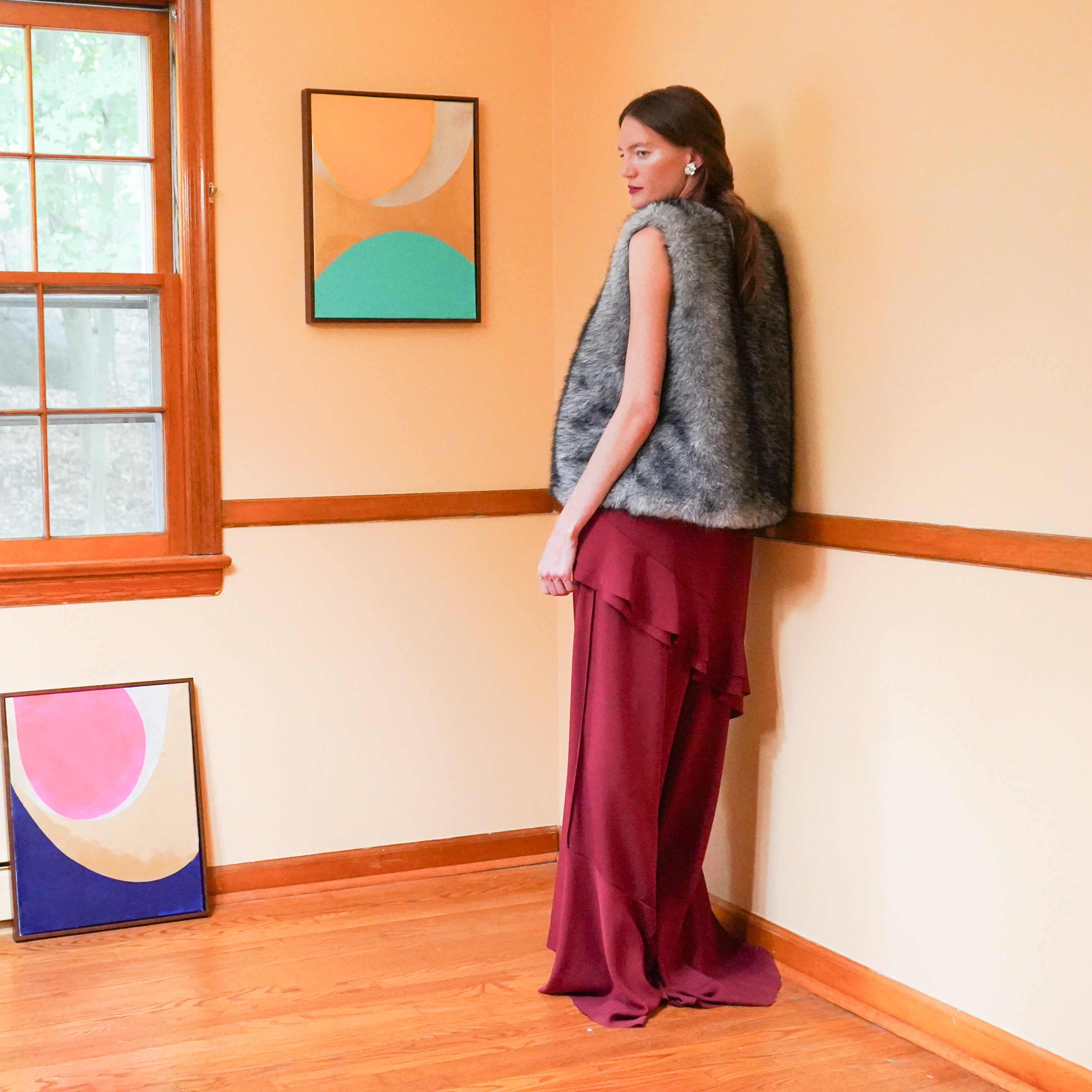 Mimosa faux fur vest over Capella maxi ruffle dress