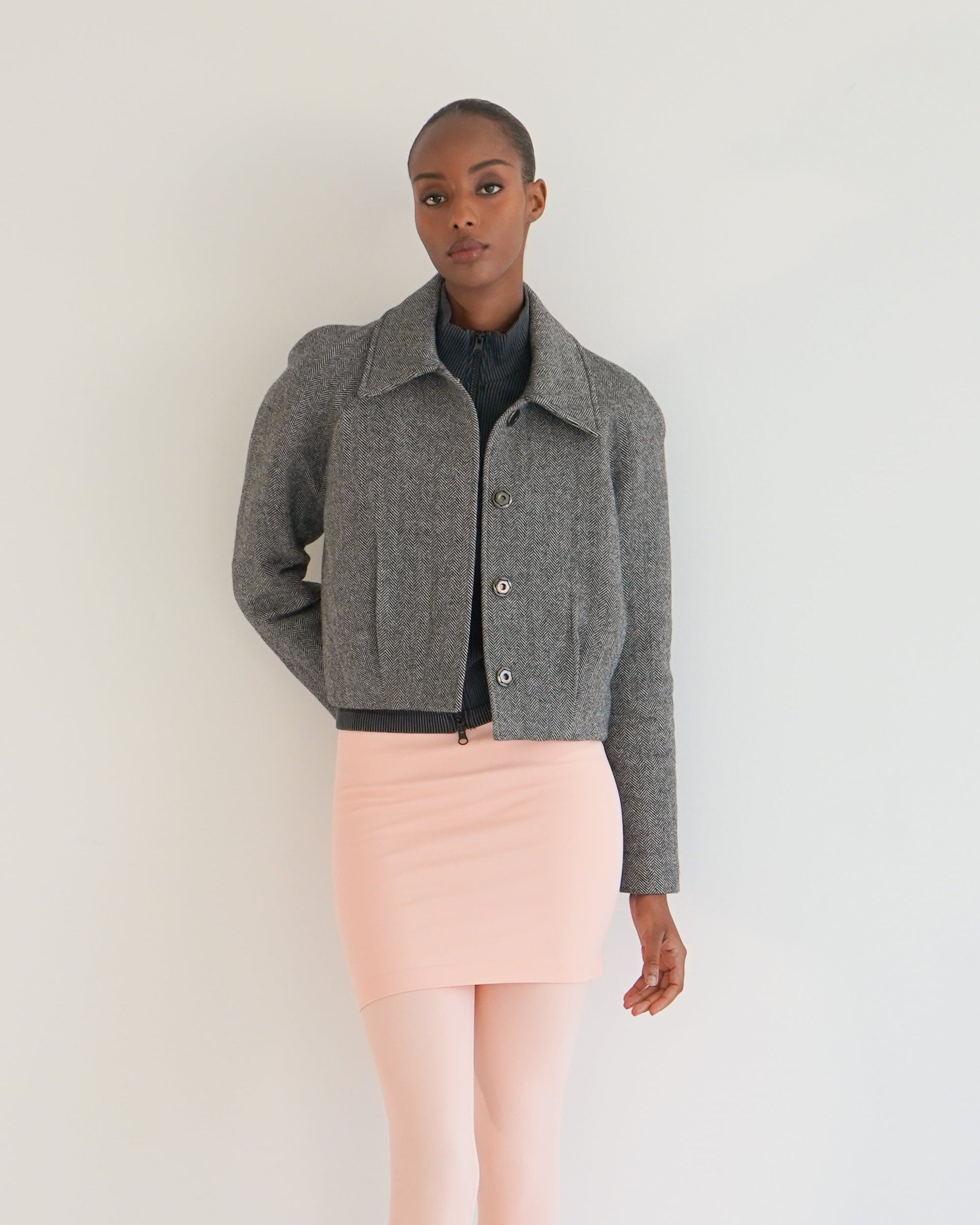 Nova jacket herringbone pleat detail — women's textured tailored outerwear
