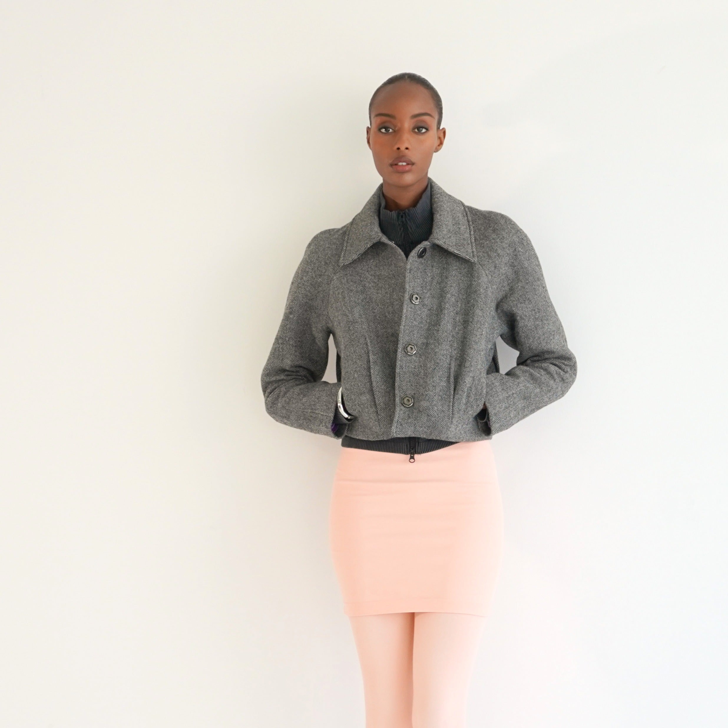 Nova jacket herringbone pleat detail — women's textured tailored outerwear
